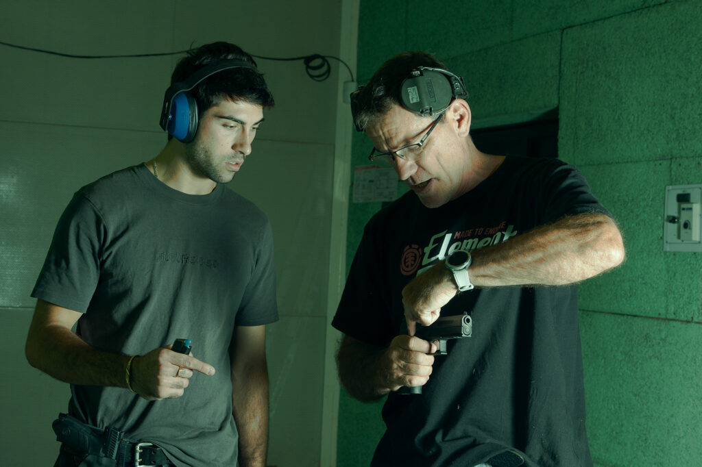 A shield Tactical instructor explaining the mechanics of a semi automatic pistol