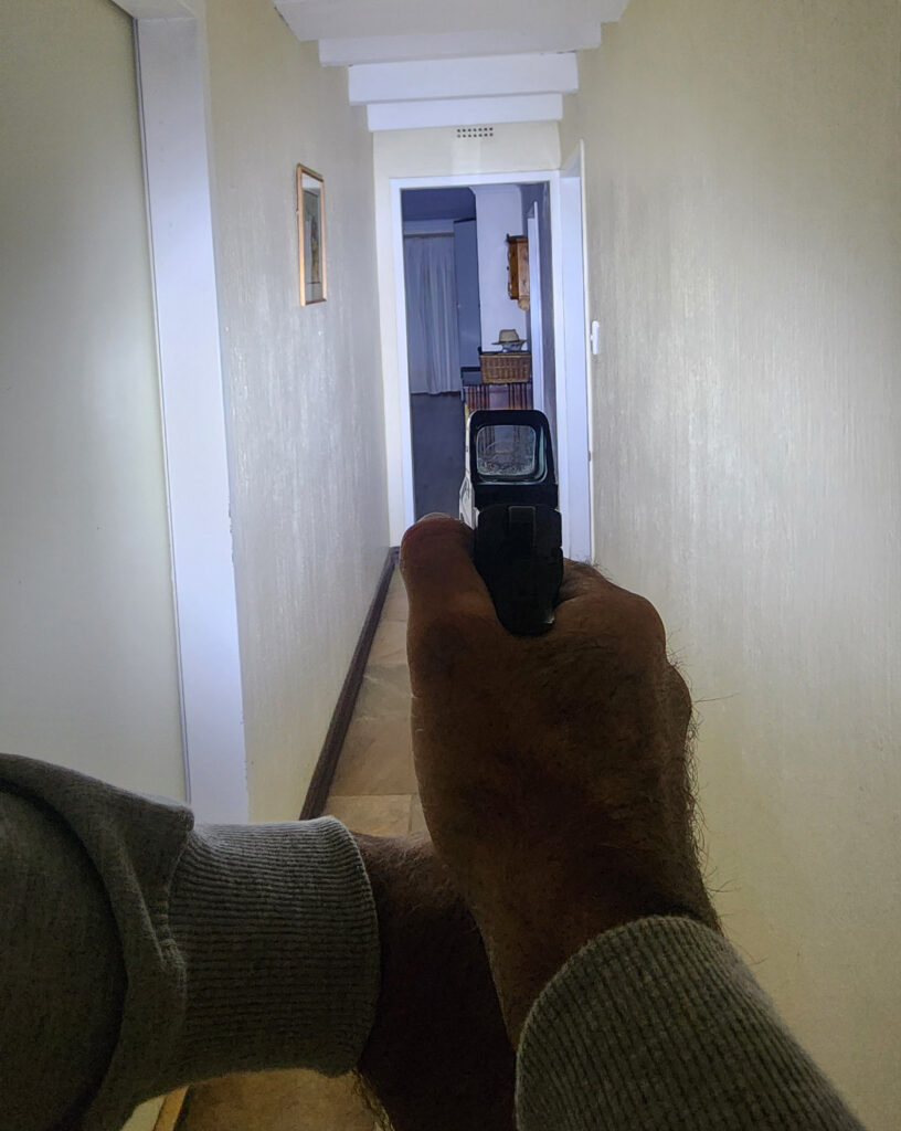 T27 Torch being used with a firearm in a dark passage at night